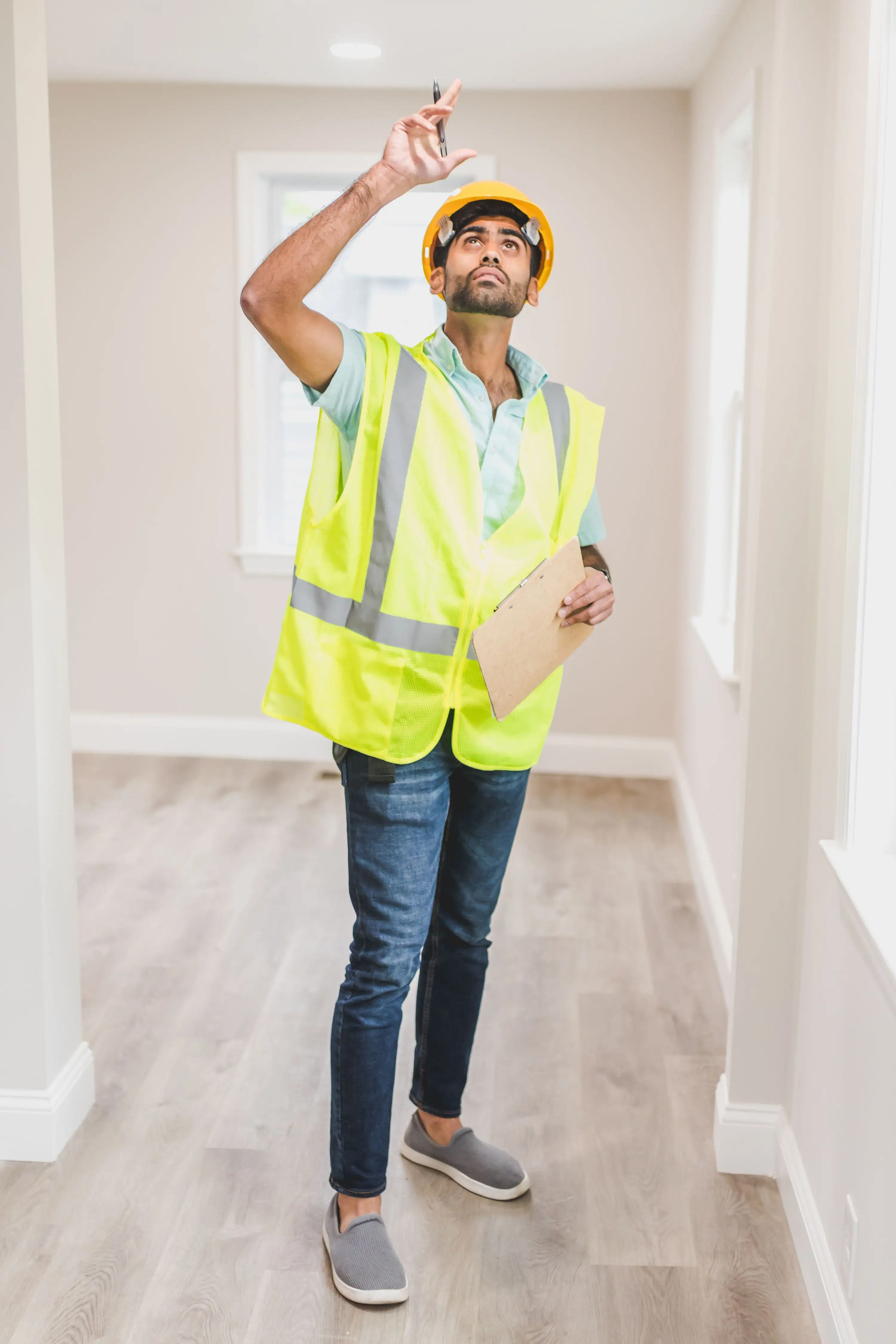 Inspector evaluating an aging Florida roof for insurance compliance