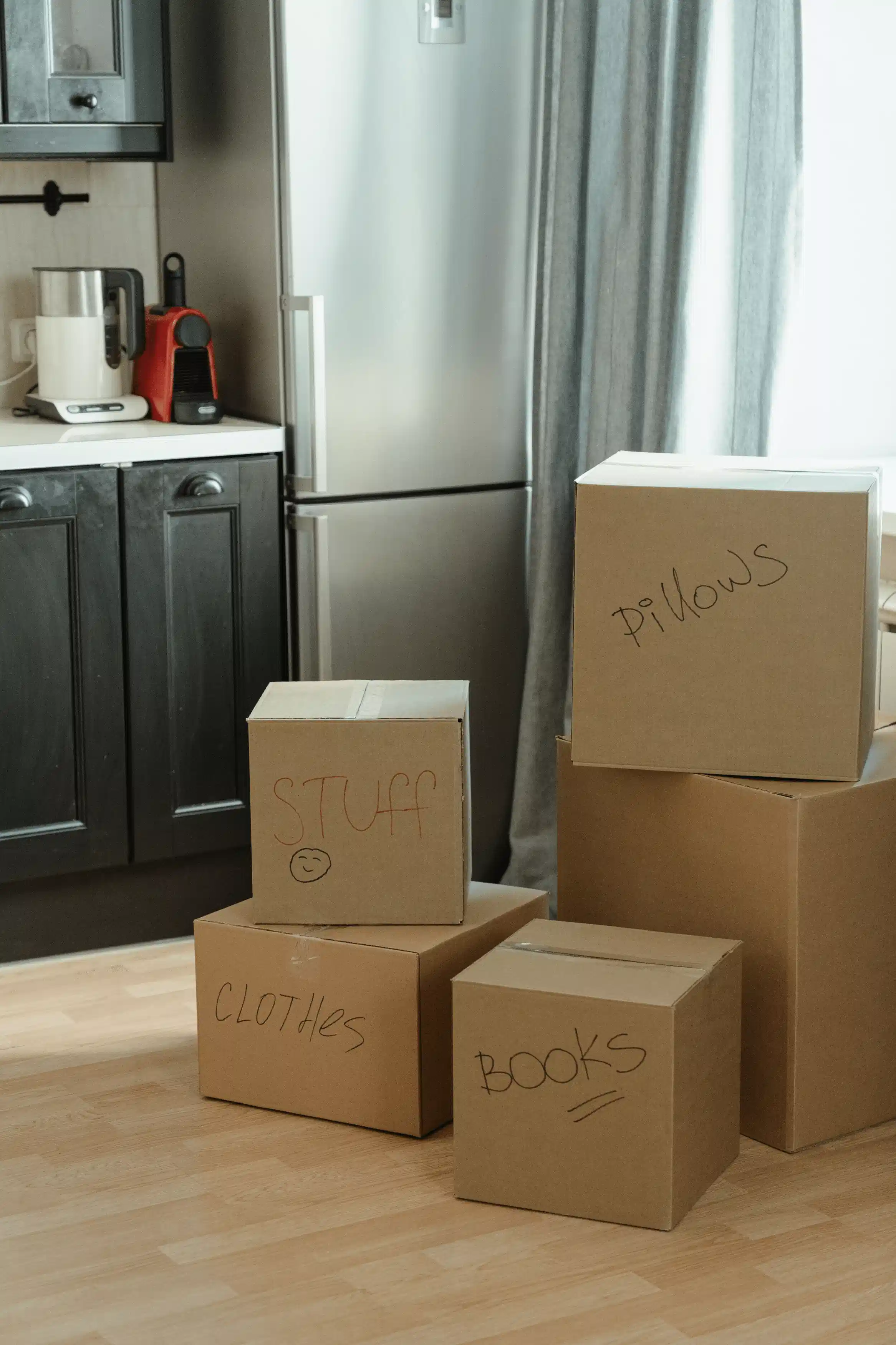 Moving boxes and packing materials sitting in the hallway of an older family home